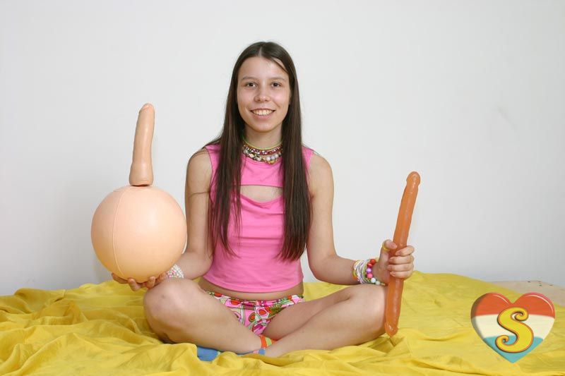 Teenage Brunette Girl Using A Weird Skippybal Dildo To Play