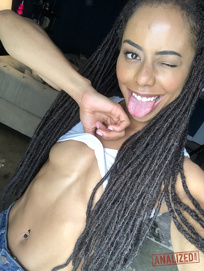 Beautiful ebony teen Kira Noir reveals her hot ass and tiny tits in a solo  