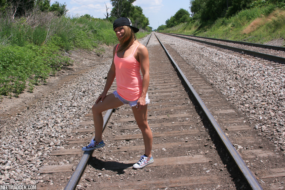 Amateur girl Meet Madden goes topless on train tracks in a backwards ball cap
