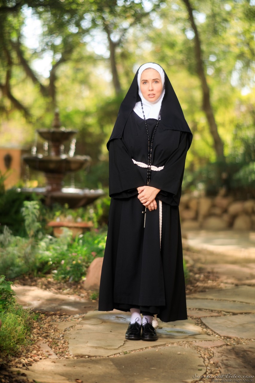Thick Nun exposes herself in the courtyard