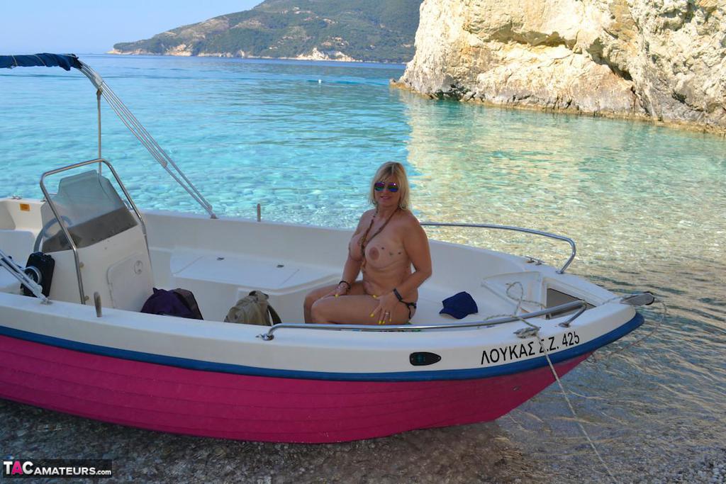 Beefy big Nude Chrissy pilots her boat naked to sun her round plump tits