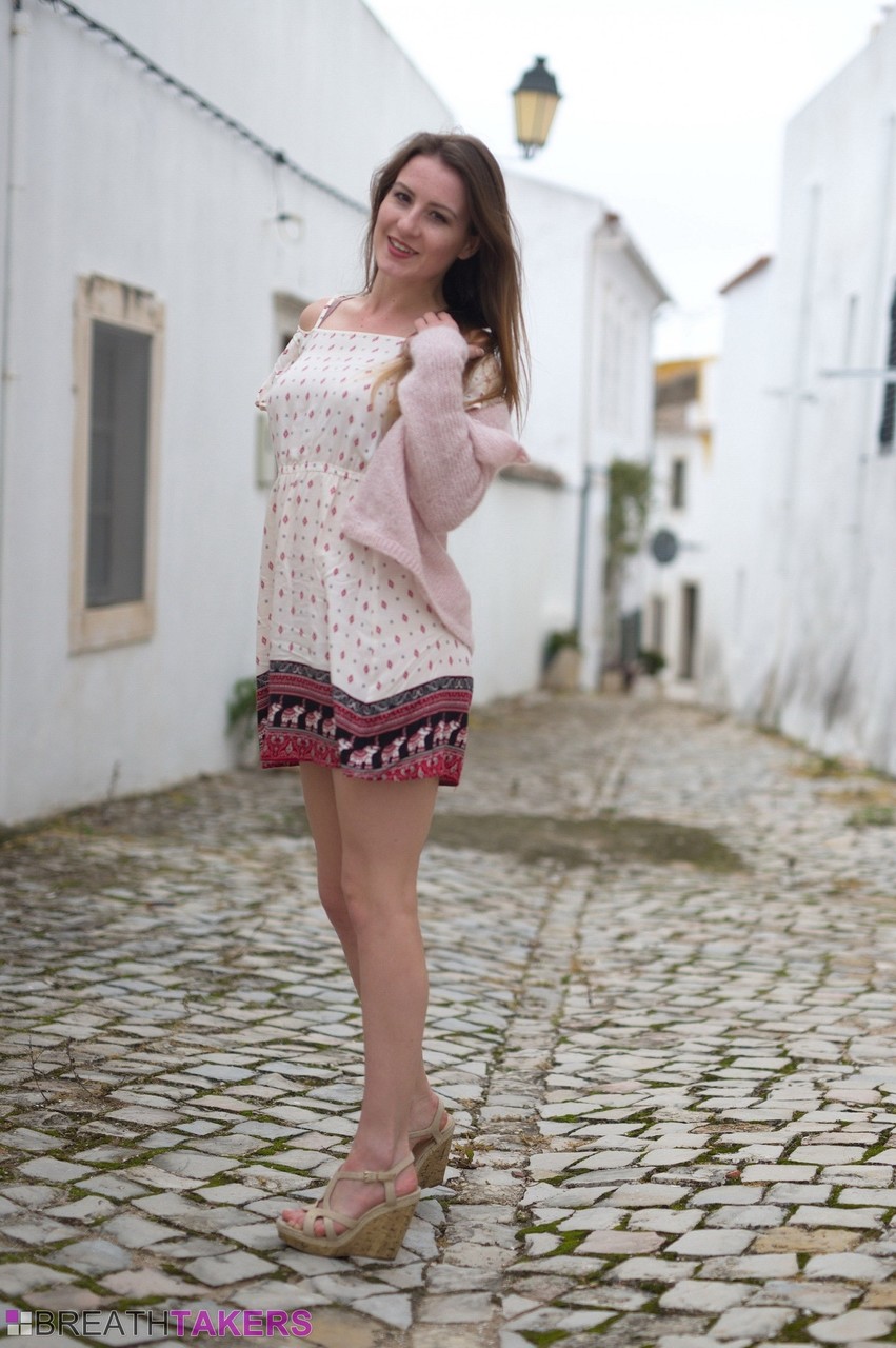British model Scarlot Rose exposes her upskirt panties on a cobblestone street