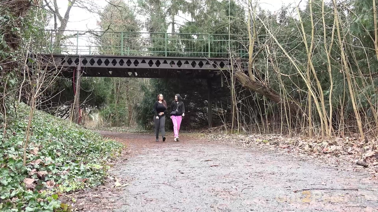 Selena and her girlfriend both squat to take a piss on a rural path