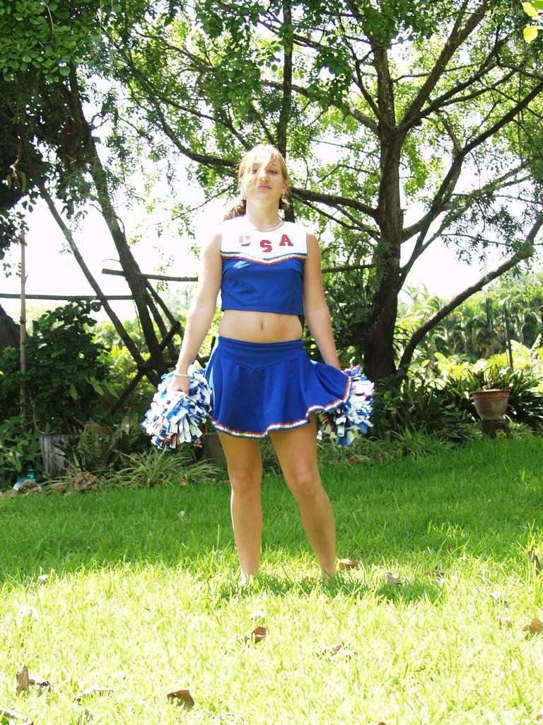 Check Out This Naughty Cheerleader As She Goes Outdoors To P...  
