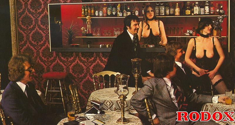 Three Topless Seventies Bartenders Serving Drinks