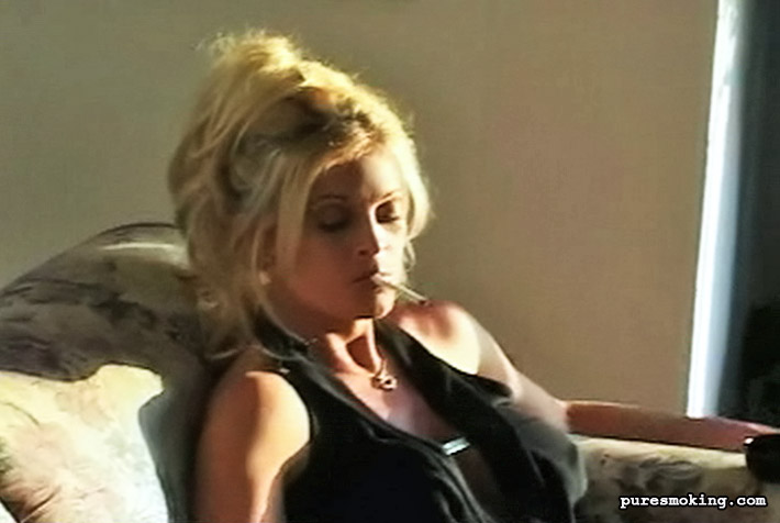 Blonde Bombshell Brooke Sits On Her Couch And Enjoys The Taste Of Her Cigarette
